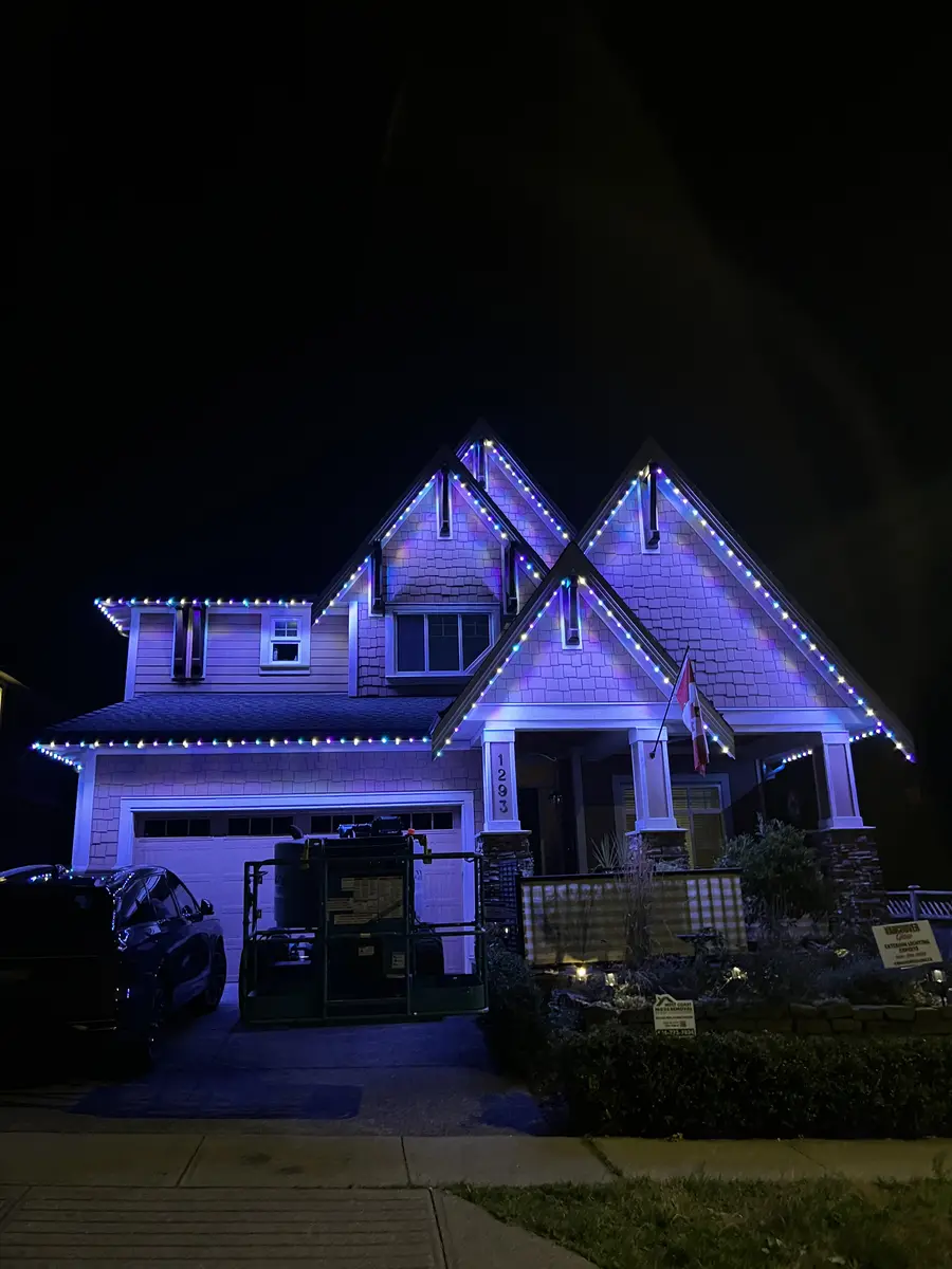 West Coast craftsman home with blue and purple permanent LED roofline lighting installed by Vancouver Glow