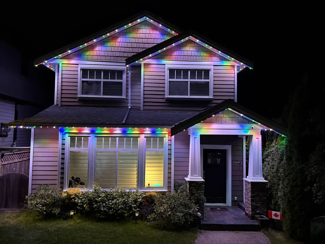 Vancouver craftsman home with full rainbow permanent LED roofline lighting installed by Vancouver Glow