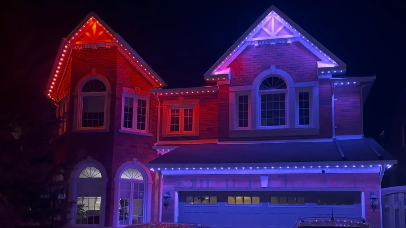Same home with permanent LED lights in three different colours — red, white, and blue — showing colour versatility by Vancouver Glow