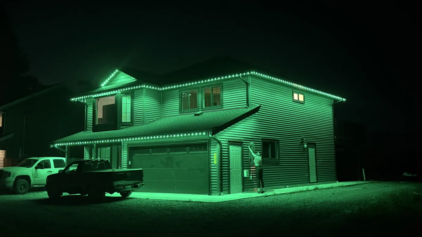 Greater Vancouver home with green permanent LED roofline lighting for St. Patrick's Day