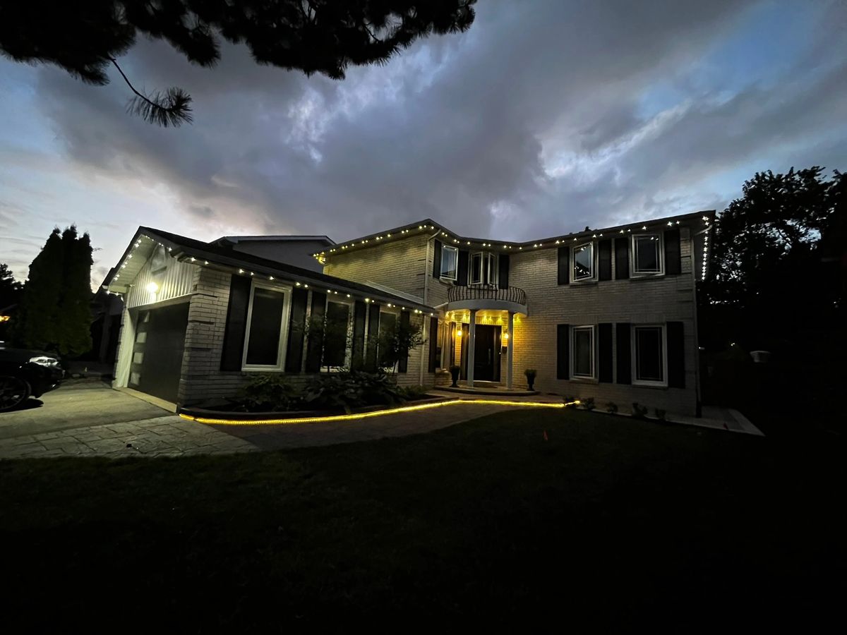 Vancouver home with warm white permanent outdoor LED roofline lighting