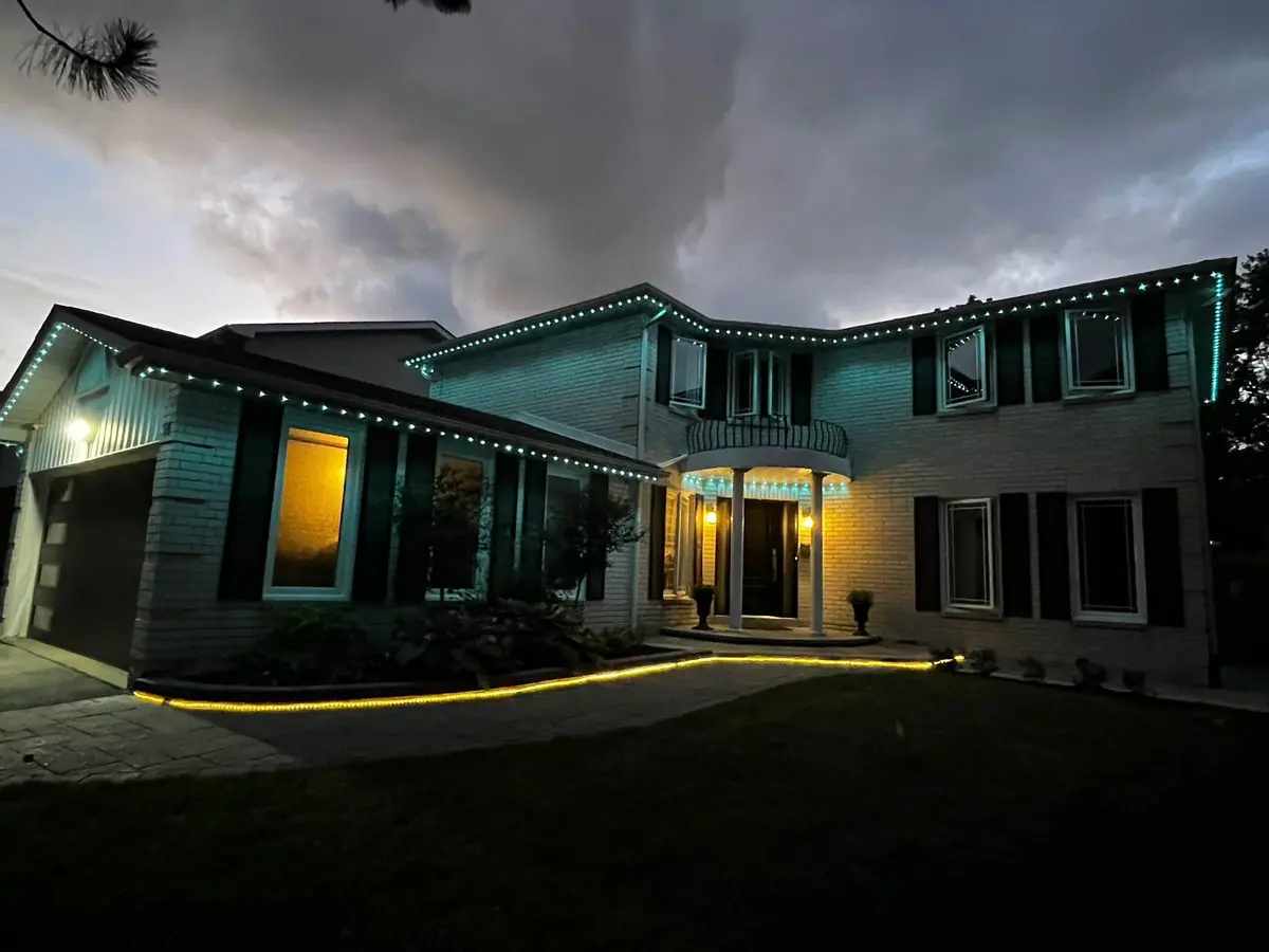 Vancouver home with aqua permanent LED lighting across roofline