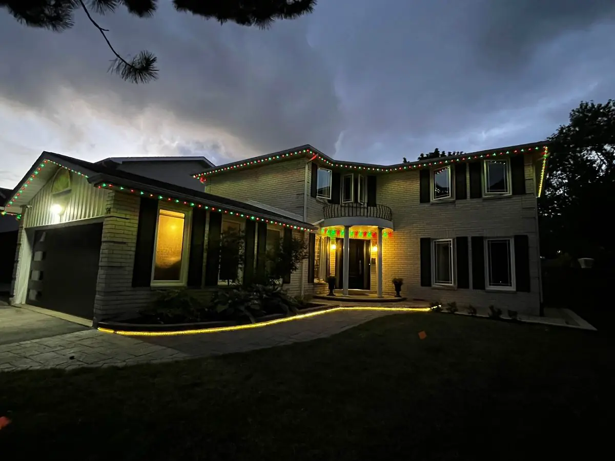 Vancouver home with red and green permanent LED lights for Christmas