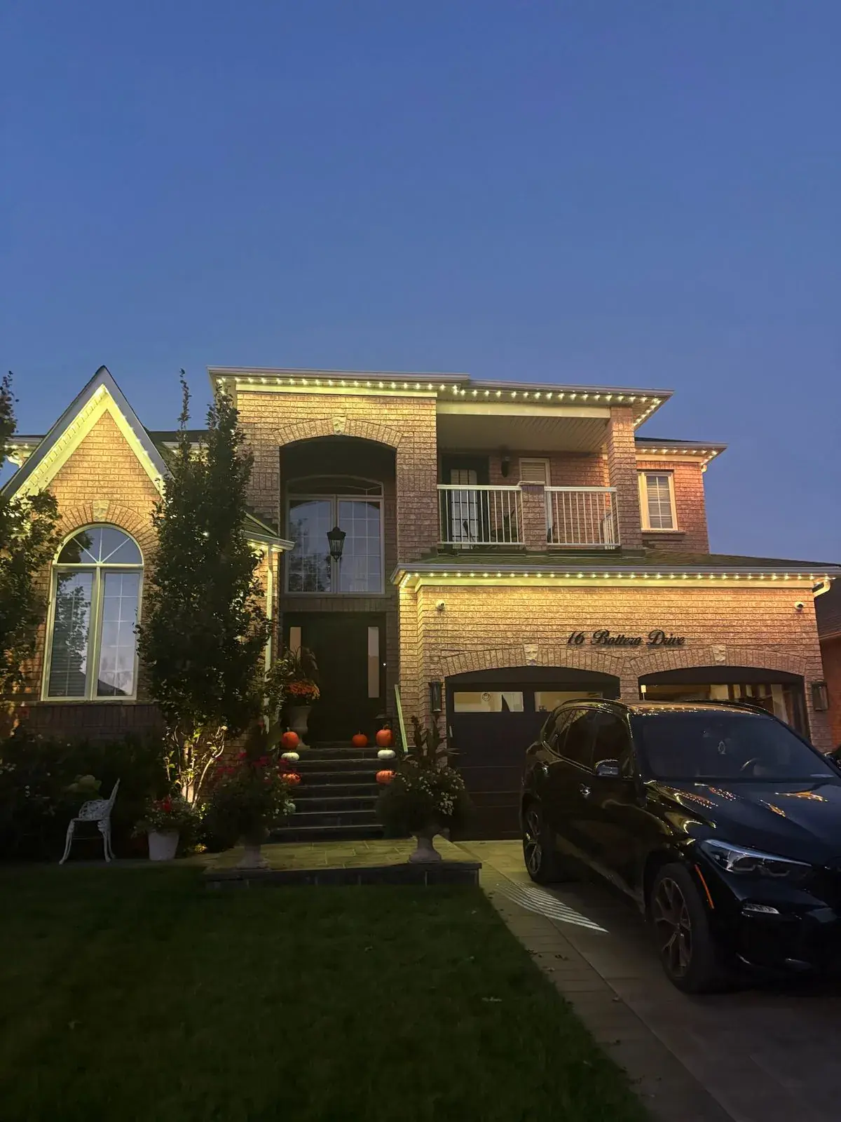 Vancouver home with warm white permanent LED roofline lighting at dusk